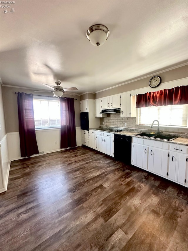 kitchen featuring dark wood finished floors, a sink, white cabinets, black appliances, and under cabinet range hood