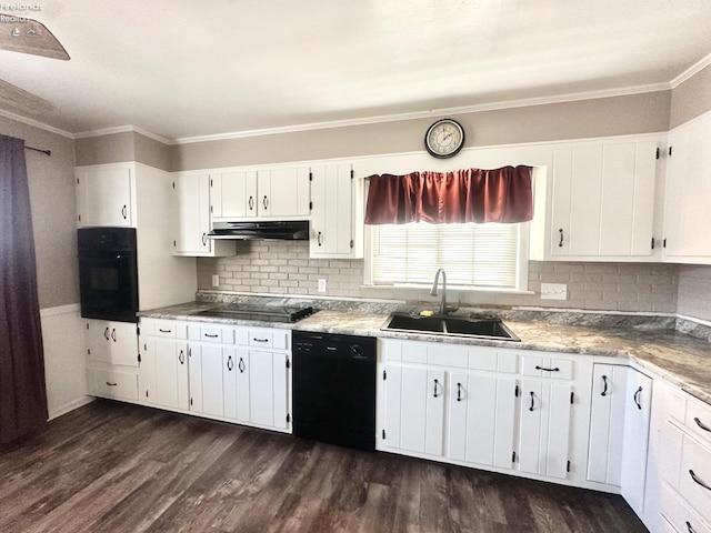 kitchen featuring a sink, black appliances, under cabinet range hood, white cabinetry, and dark wood-type flooring
