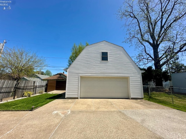 garage with fence and a garage