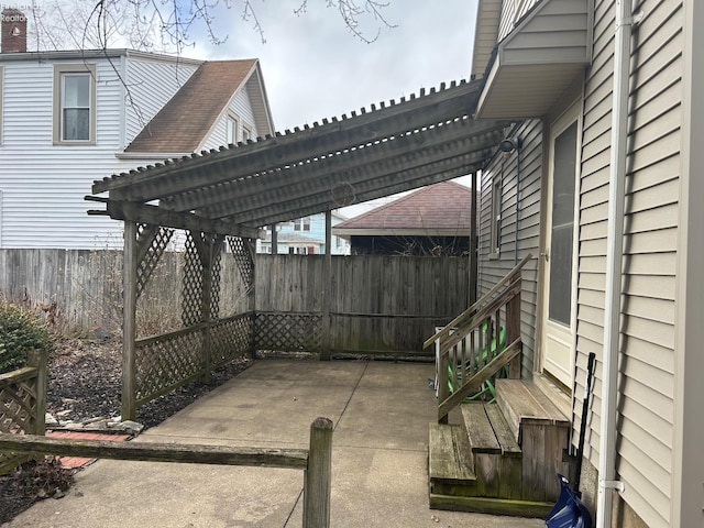 view of patio with fence and a pergola