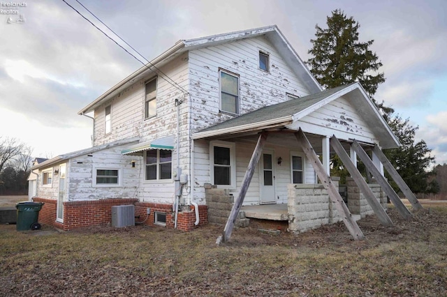 view of front of house featuring covered porch and central air condition unit