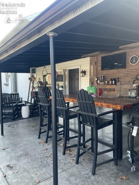 view of patio / terrace featuring outdoor dry bar