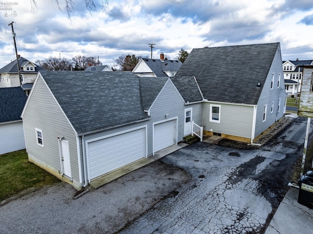 exterior space with aphalt driveway