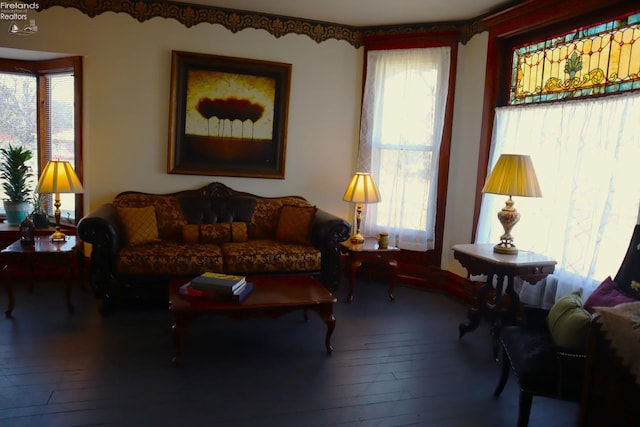 living area with hardwood / wood-style flooring