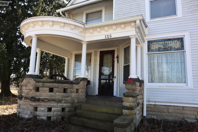 property entrance featuring a porch