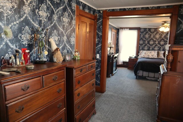 carpeted bedroom featuring wallpapered walls