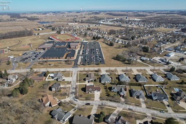 birds eye view of property with a residential view