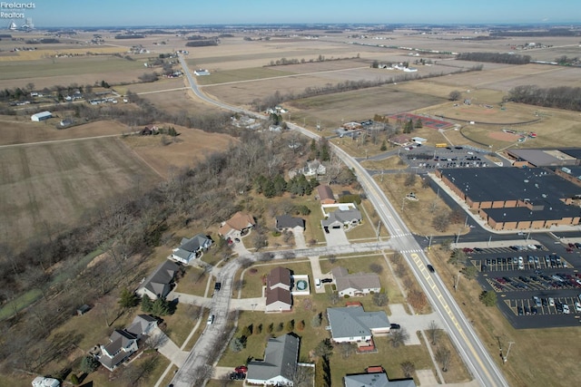 birds eye view of property with a rural view