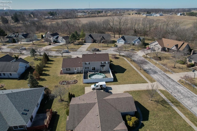 birds eye view of property with a residential view