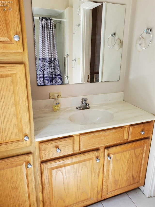 full bathroom featuring tile patterned floors, vanity, and a shower with shower curtain