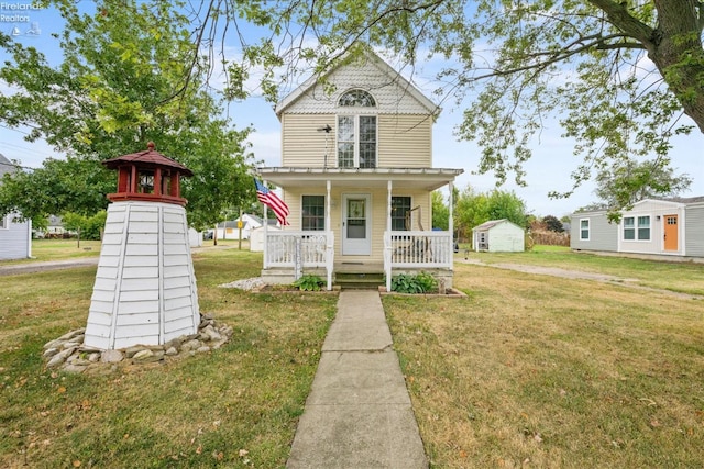 victorian home featuring covered porch and a front lawn