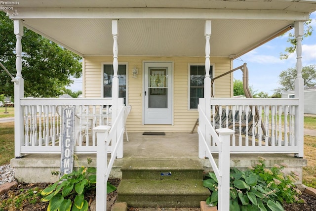 property entrance featuring covered porch