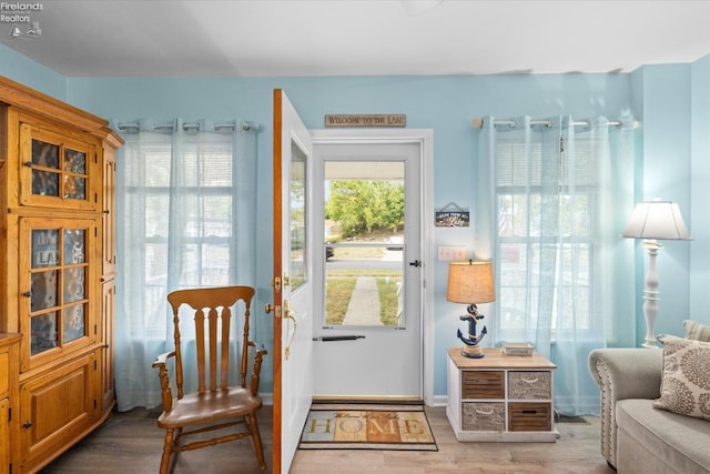 doorway to outside featuring wood finished floors