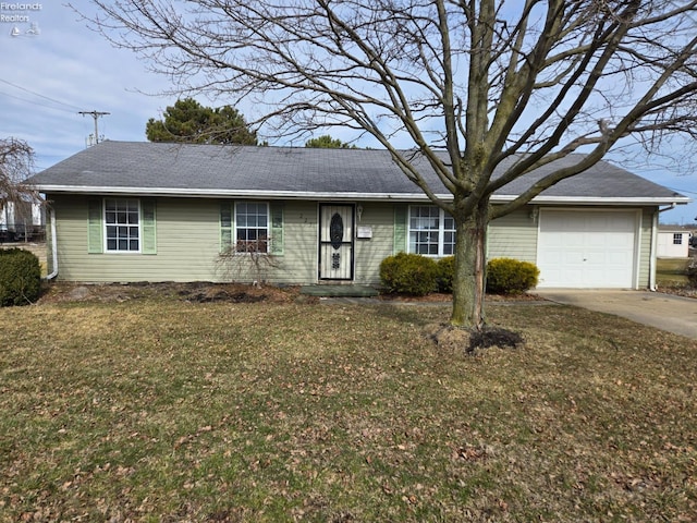 single story home featuring driveway, a front lawn, and an attached garage