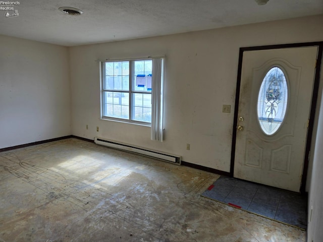 entrance foyer with a baseboard heating unit, baseboards, visible vents, and a textured ceiling