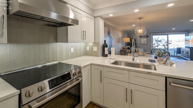 kitchen featuring light stone countertops, ornamental molding, stainless steel appliances, wall chimney exhaust hood, and backsplash