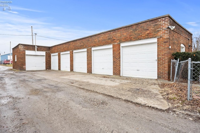 garage with fence