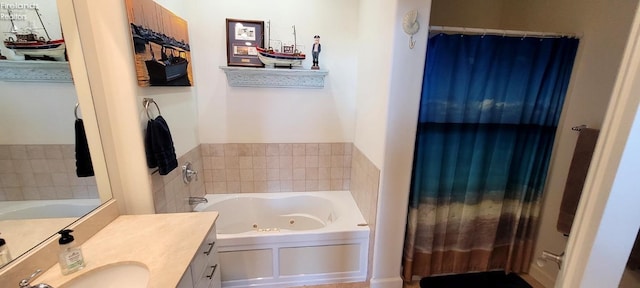 full bath featuring vanity and a jetted tub