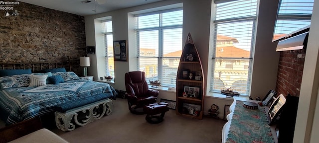 carpeted bedroom with multiple windows