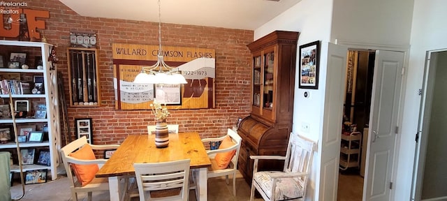 dining area with brick wall