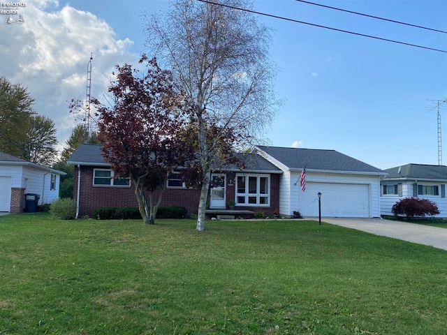 ranch-style house with concrete driveway, an attached garage, brick siding, and a front yard