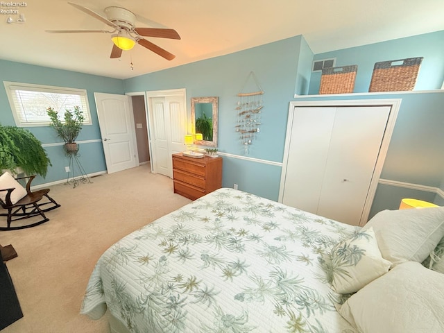 bedroom featuring baseboards, visible vents, a ceiling fan, and carpet