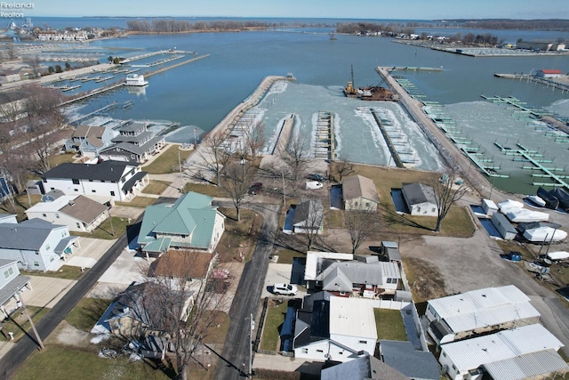 drone / aerial view featuring a water view and a residential view