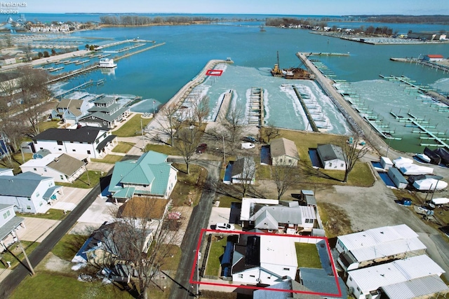 aerial view featuring a water view and a residential view