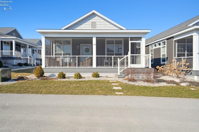 view of front facade featuring a sunroom