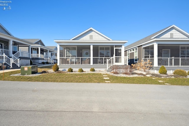 view of front of property featuring a sunroom