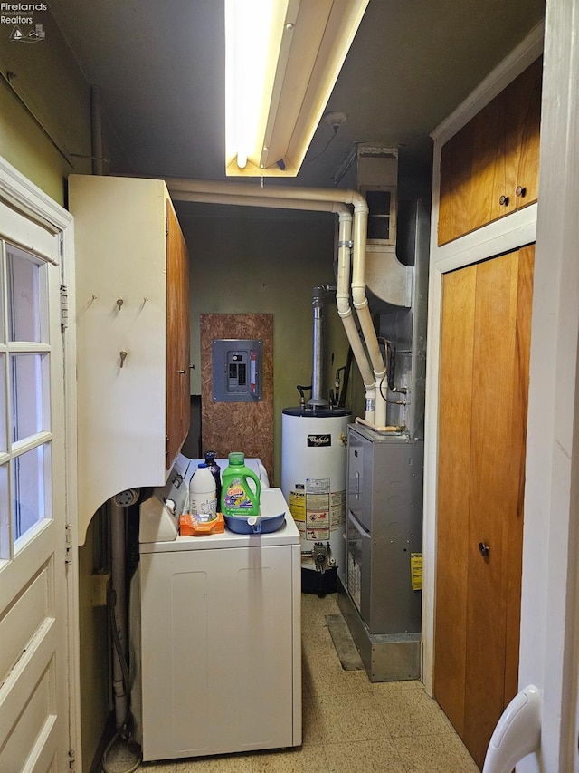 clothes washing area with light floors, electric panel, washer / clothes dryer, cabinet space, and gas water heater