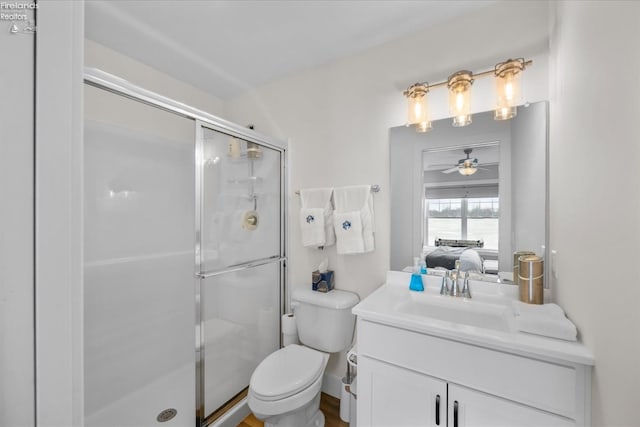 bathroom featuring vanity, ensuite bath, ceiling fan, a shower stall, and toilet