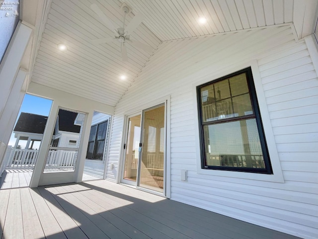 wooden deck featuring a ceiling fan