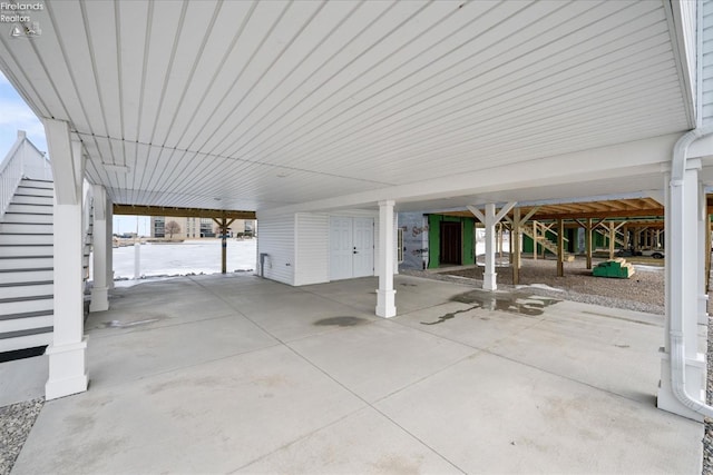 view of patio / terrace with a carport and stairway