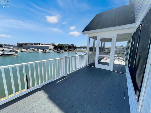 wooden terrace with a water view