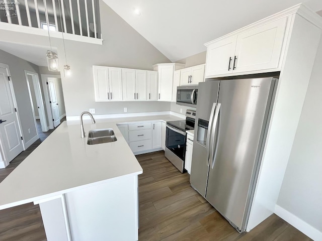 kitchen featuring dark wood-style flooring, a sink, light countertops, appliances with stainless steel finishes, and white cabinetry