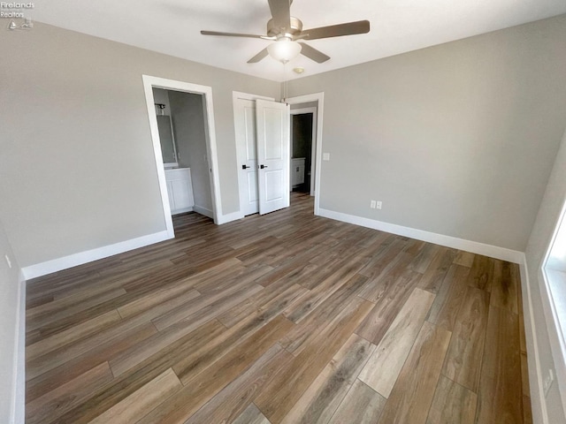 unfurnished bedroom featuring a ceiling fan, baseboards, and wood finished floors