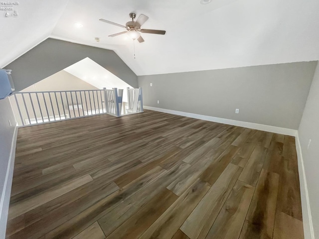 bonus room with lofted ceiling, wood finished floors, baseboards, and ceiling fan