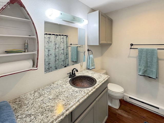 full bathroom featuring vanity, a shower with curtain, wood finished floors, toilet, and baseboard heating