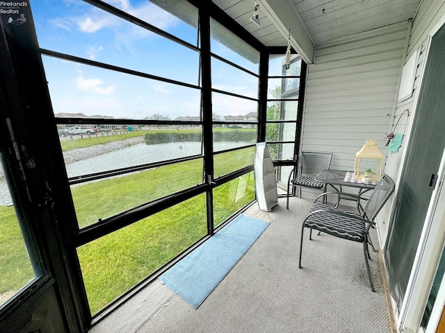 sunroom with a water view