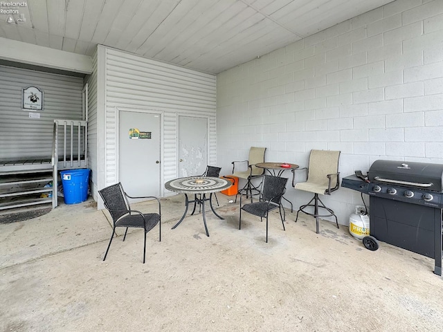 view of patio featuring a grill