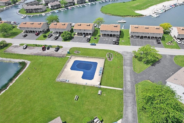 birds eye view of property featuring a residential view and a water view