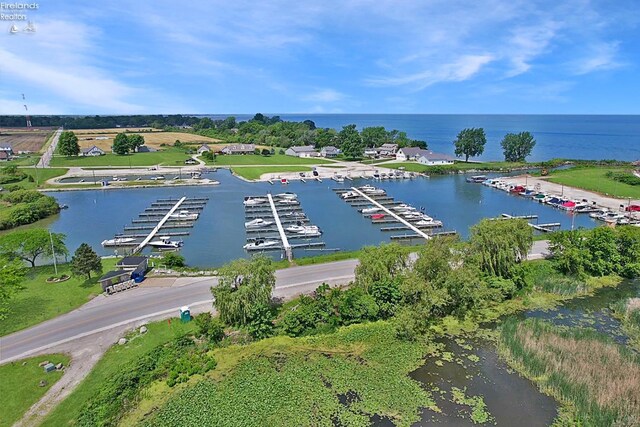 birds eye view of property with a water view