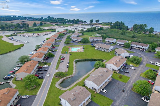 birds eye view of property with a water view