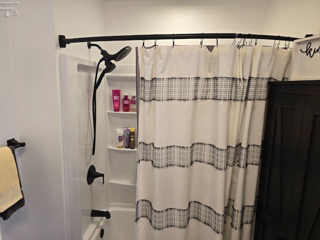 full bath featuring shower / bath combo with shower curtain