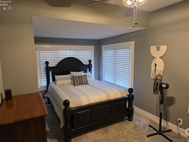 carpeted bedroom with baseboards