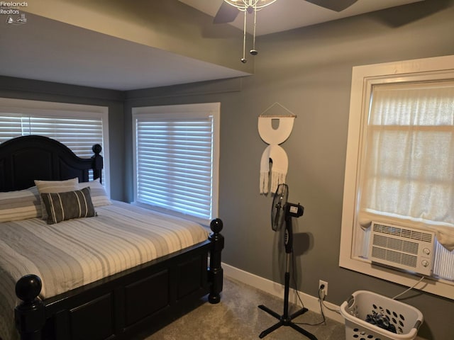 bedroom featuring a ceiling fan, cooling unit, carpet, and baseboards