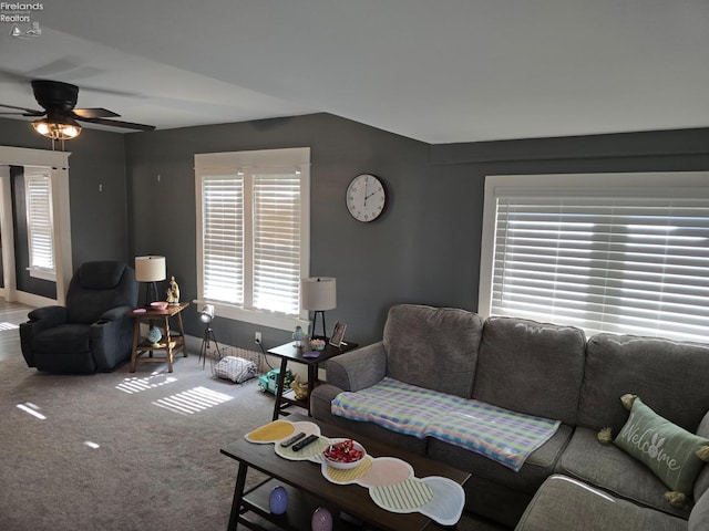 carpeted living room featuring ceiling fan