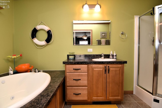 full bathroom with tile patterned flooring, a shower stall, a bath, and vanity