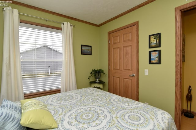 bedroom with ornamental molding